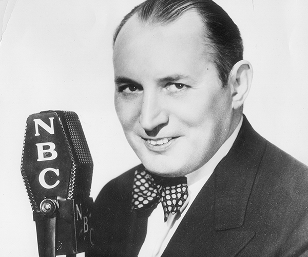 Robert Ripley holding an NBC radio microphone