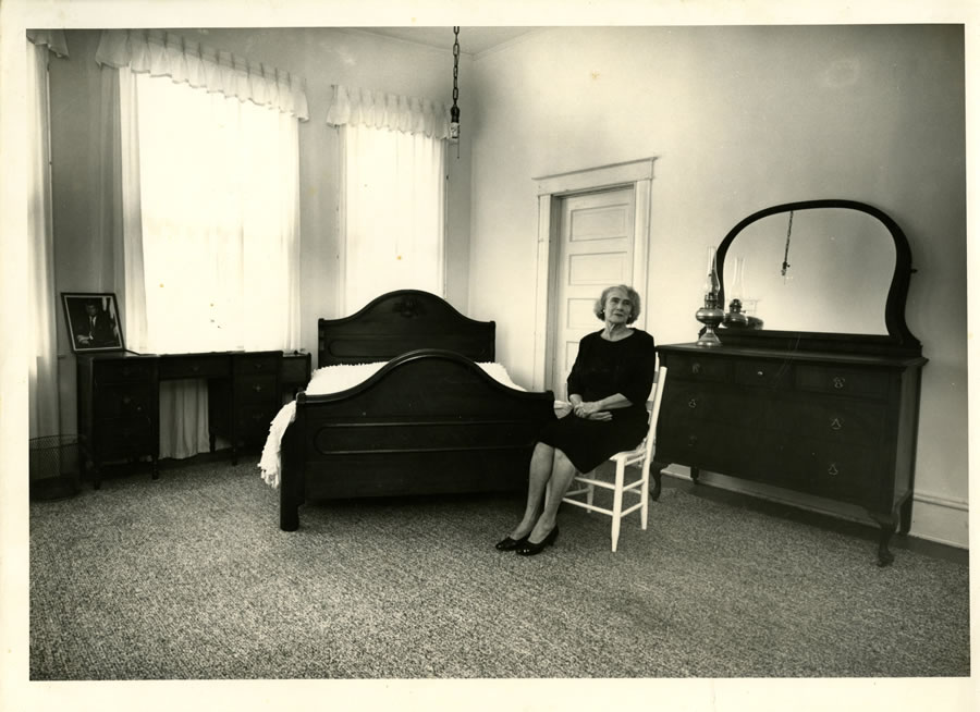 Mary Bledsoe sitting in the room she rented to Lee Harvey Oswald
