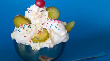 Bowl of ice cream with sprinkles and pickles