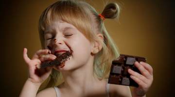 Little girl with Chocolate Bar
