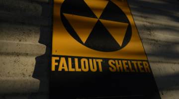 Vintage 1960s Cold War radioactive fallout shelter sign.